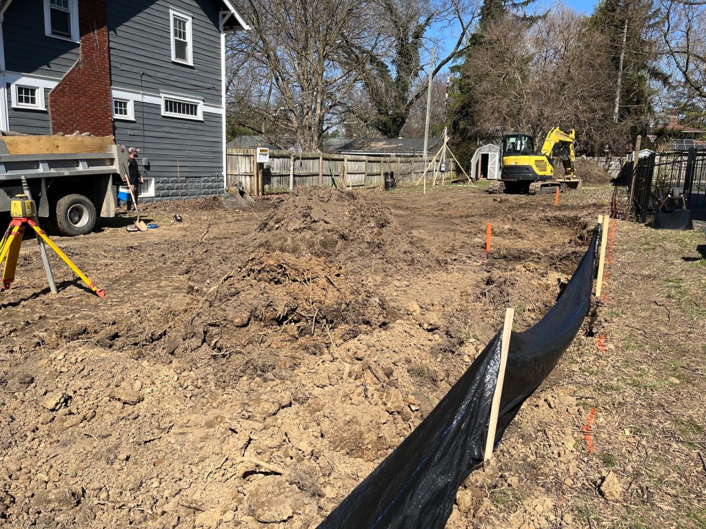 excavation beginning by scraping topsoil