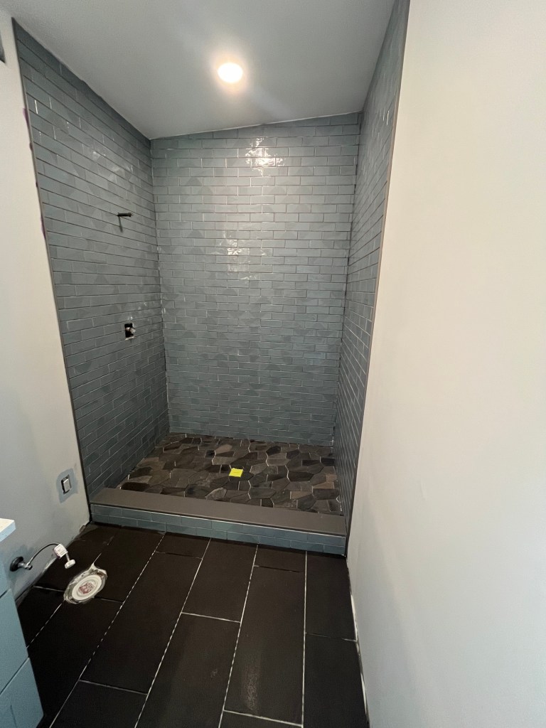 Main bathroom shower in process of being tiled